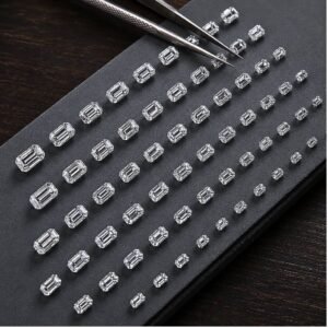 Premium emerald cut loose lab grown diamonds sorted by size on black slate display – Mira Art Collection