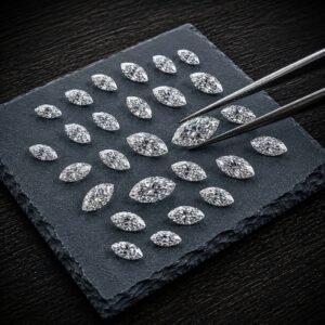 High quality lab created marquise diamonds featuring a large center stone held by tweezers.