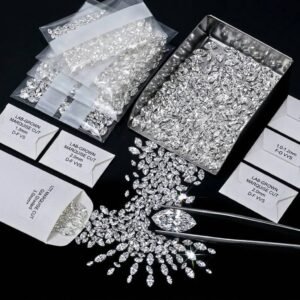 Loose lab grown marquise cut diamond lots with GIA graded packaging and jewelry sorting tweezers.