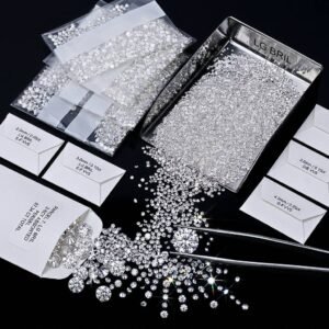 Bulk parcel of round melee lab grown diamonds sorted by size in packets and trays for jewelry manufacturing and wholesale supply.