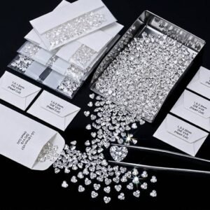 Wholesale lab grown heart cut diamonds sorted by size and clarity into labeled parcel papers at Mira Art Collection.